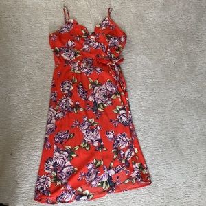 Sweet, flattering wrap dress.  Inside butting makes sure it stays closed.